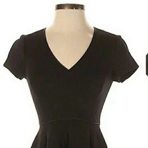 Fit and flare black dress.